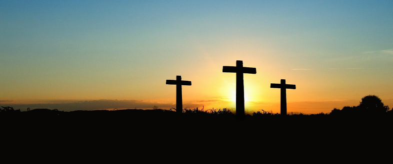Three crosses at sunrise symbolizing hope and the promise of eternal life – John 3:16